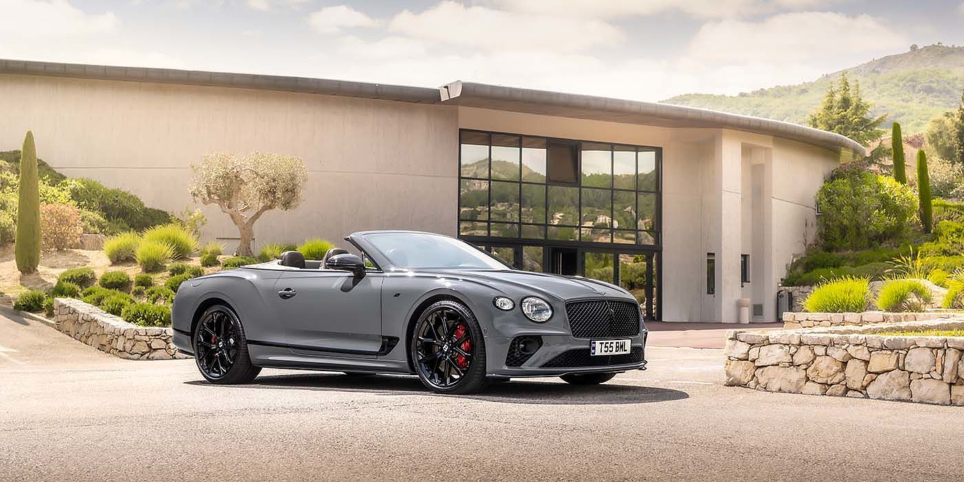 Bentley Kuala Lumpur Bentley Continental GTC S convertible in Cambrian Grey paint front 34 static near house