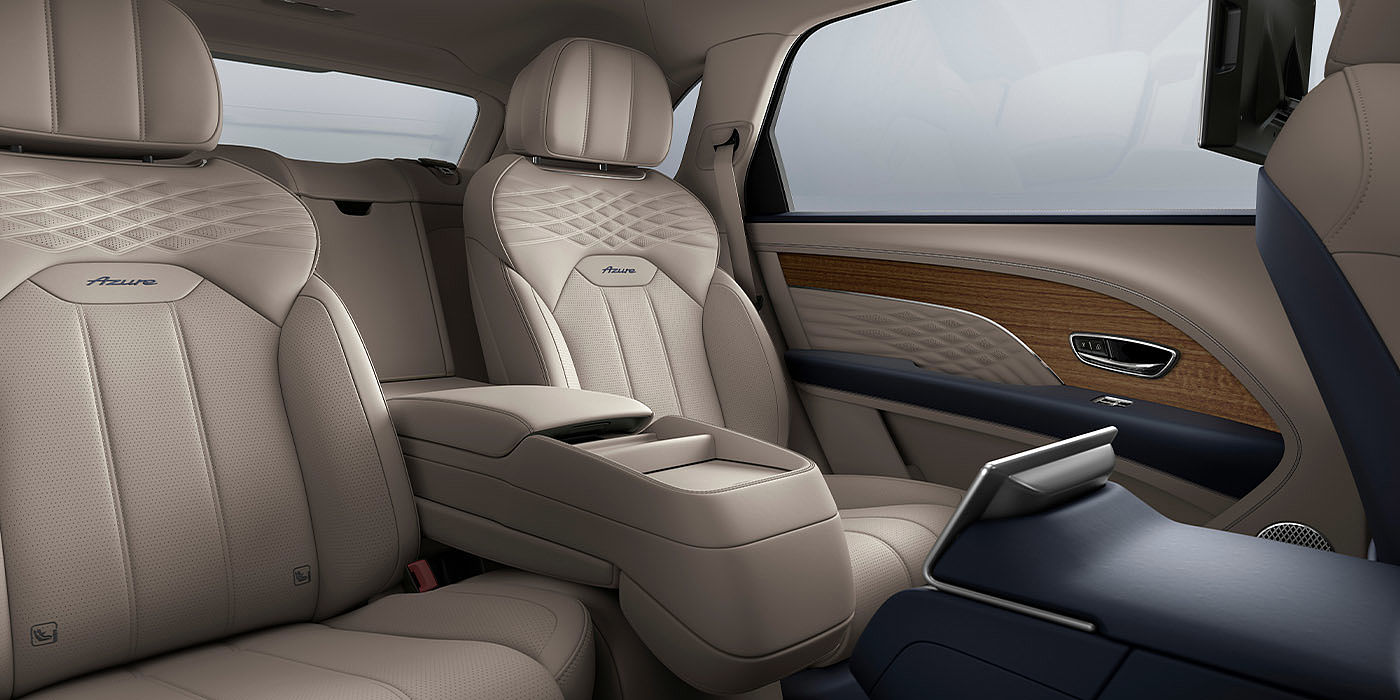 Bentley Kuala Lumpur Bentley Bentayga EWB Azure interior view for rear passengers with Portland hide featuring Azure Emblem in Imperial Blue contrast stitch.
