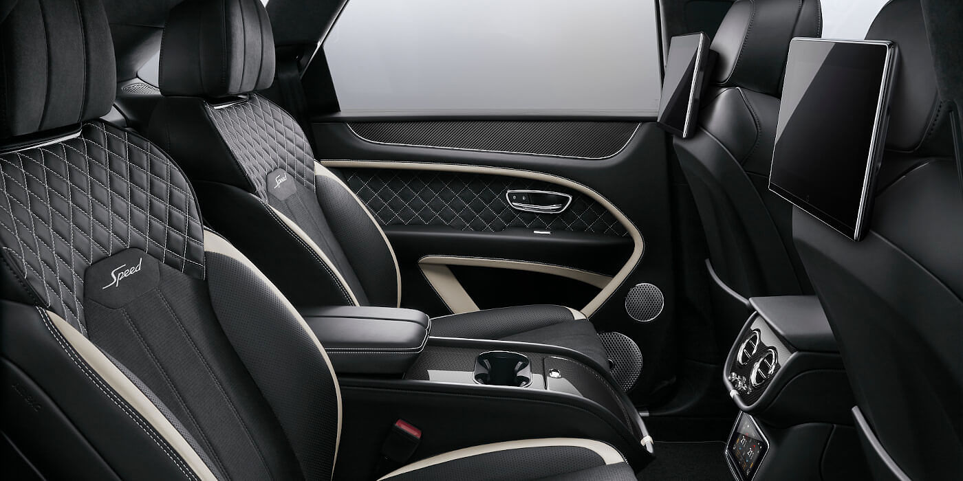 Bentley Kuala Lumpur Bentley Bentayga Speed SUV rear interior in Beluga black and Linen hide with carbon fibre veneer