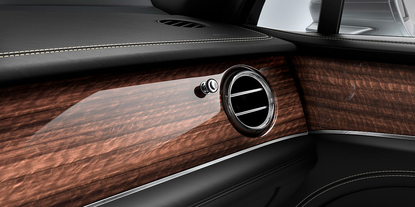 Bentley Kuala Lumpur Bentley Bentayga front interior Crown Cut Walnut veneer and chrome air vent.