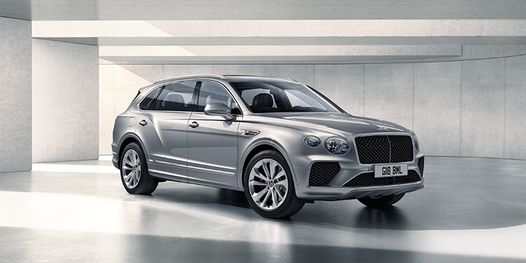 Bentley Kuala Lumpur Bentley Bentayga Extended Wheelbase SUV front three quarter in Moonbeam paint with a grey background