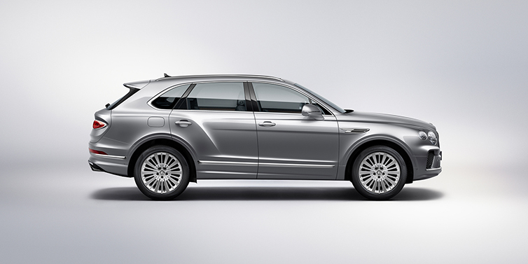 Bentley Kuala Lumpur Bentley Bentayga SUV side profile in Moonbeam silver paint against white background featuring 21 inch 5 spoke wheels