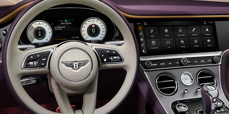 Bentley Kuala Lumpur Bentley Continental GTC Mulliner convertible steering wheel and drivers screens surrounded by Damson purple and Linen hides